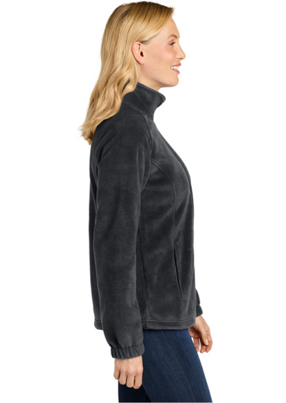 Woman wearing a gray fleece jacket on a white background